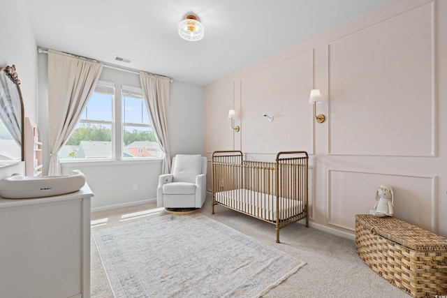 2620 Blue Crane Cir Unit 103, Myrtle Beach, SC 29577 - bedroom featuring carpet floors, a nursery area, and baseboards