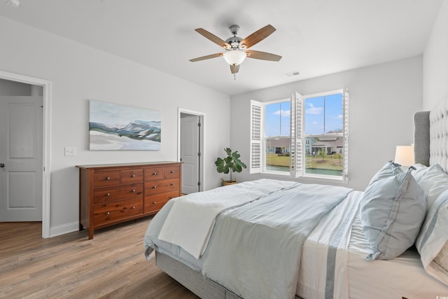 2620 Blue Crane Cir Unit 103, Myrtle Beach, SC 29577 - bedroom with light wood-type flooring, baseboards, and ceiling fan