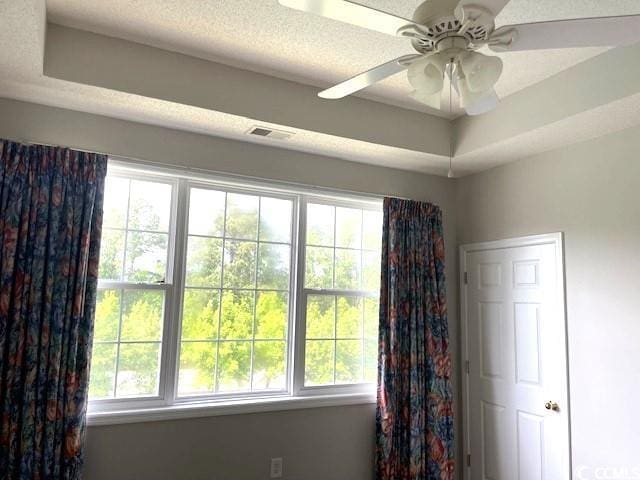 5825 Catalina Dr Unit 234, North Myrtle Beach, SC 29582 - unfurnished room with visible vents, a ceiling fan, and plenty of natural light