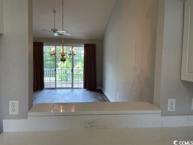 5825 Catalina Dr Unit 234, North Myrtle Beach, SC 29582 - unfurnished dining area with vaulted ceiling and ceiling fan with notable chandelier