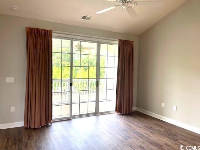 5825 Catalina Dr Unit 234, North Myrtle Beach, SC 29582 - unfurnished room with dark wood-type flooring, visible vents, ceiling fan, and baseboards
