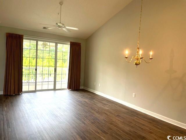 5825 Catalina Dr Unit 234, North Myrtle Beach, SC 29582 - unfurnished room featuring dark wood-type flooring, high vaulted ceiling, baseboards, and ceiling fan with notable chandelier