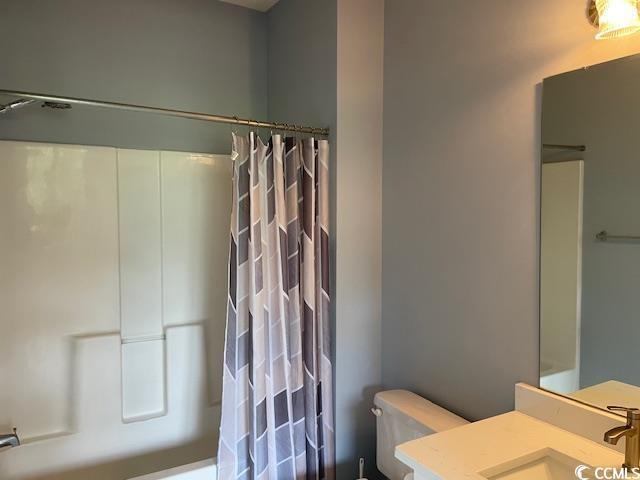 5825 Catalina Dr Unit 234, North Myrtle Beach, SC 29582 - full bathroom featuring shower / tub combo, toilet, and vanity