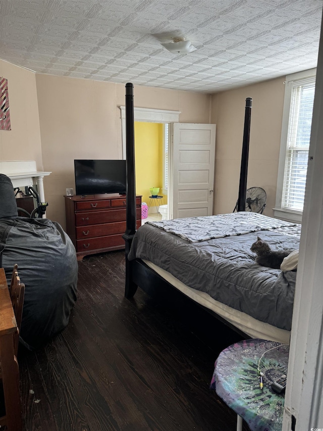 bedroom featuring wood finished floors