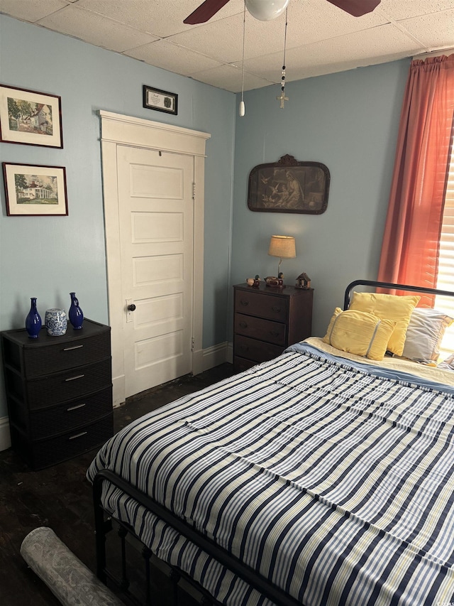 bedroom with baseboards and ceiling fan