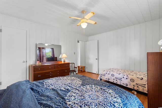 bedroom with wood finished floors and a ceiling fan