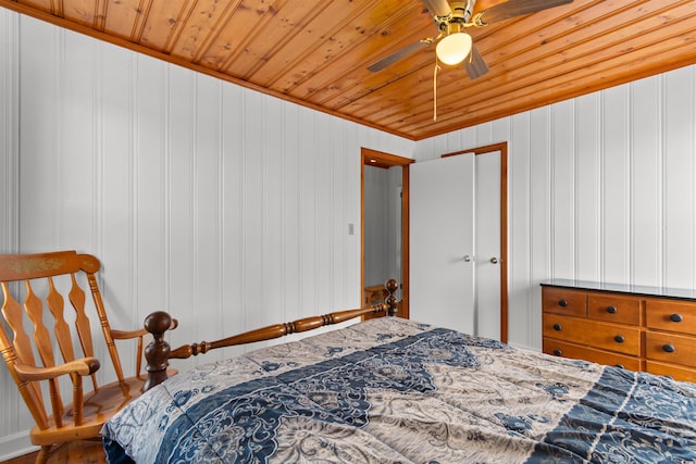 bedroom featuring wood ceiling, a ceiling fan, and crown molding