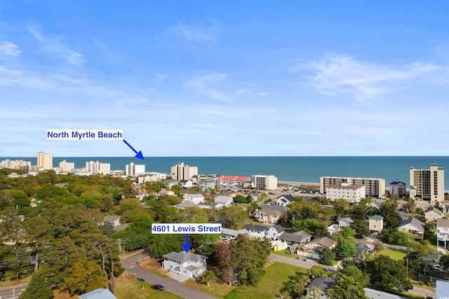 view of urban area featuring a nearby body of water