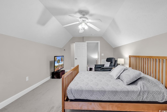 bedroom featuring a ceiling fan, baseboards, carpet, and vaulted ceiling