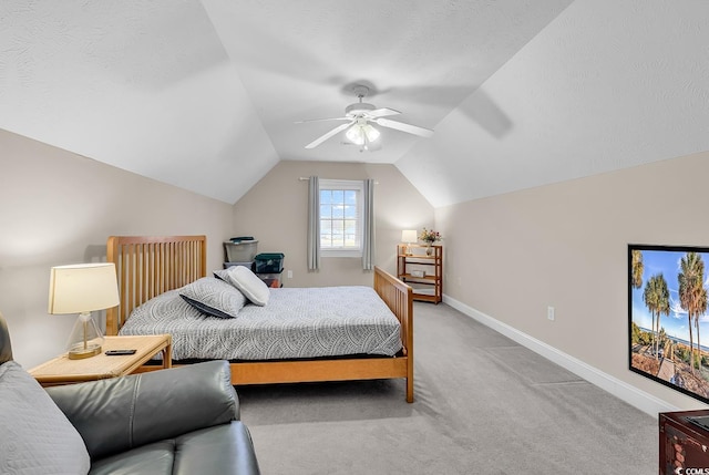 carpeted bedroom featuring baseboards, ceiling fan, and lofted ceiling