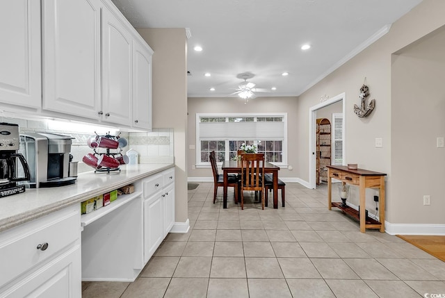 kitchen with decorative backsplash, light tile patterned flooring, ceiling fan, recessed lighting, and white cabinetry