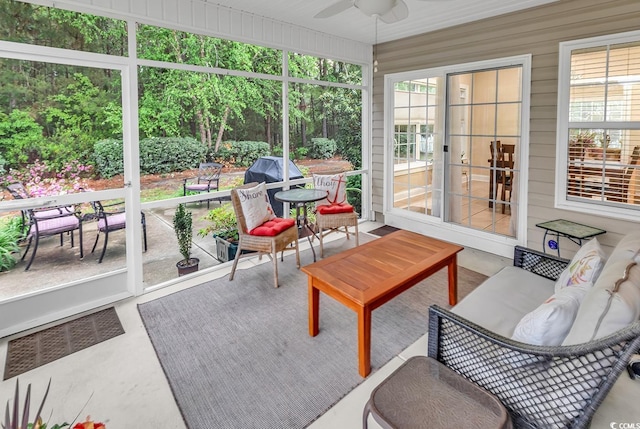 sunroom / solarium with outdoor dining area, ceiling fan, visible vents, and outdoor lounge area