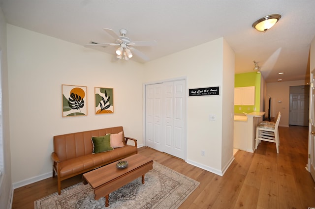 4660 Lightkeepers Way Unit 37B, Little River, SC 29566 - living area with ceiling fan, light wood-style floors, and baseboards