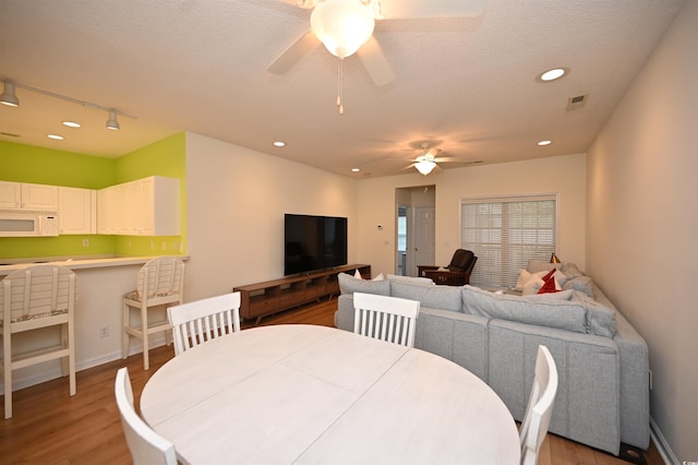 4660 Lightkeepers Way Unit 37B, Little River, SC 29566 - dining room featuring a ceiling fan, light wood-style flooring, recessed lighting, baseboards, and rail lighting
