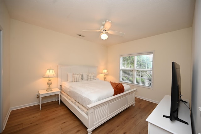4660 Lightkeepers Way Unit 37B, Little River, SC 29566 - bedroom with light wood finished floors, baseboards, and ceiling fan