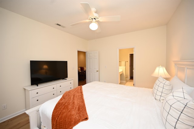 4660 Lightkeepers Way Unit 37B, Little River, SC 29566 - bedroom with wood finished floors, baseboards, ensuite bath, and a ceiling fan