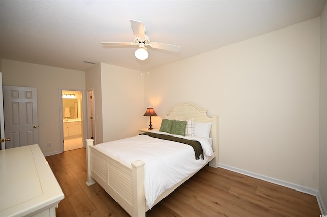 4660 Lightkeepers Way Unit 37B, Little River, SC 29566 - bedroom with wood finished floors, baseboards, ensuite bath, and ceiling fan