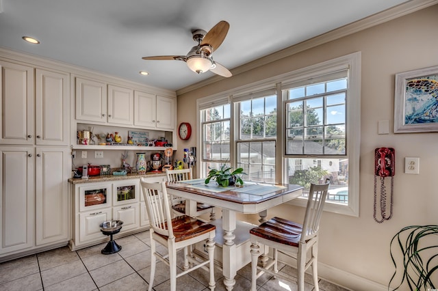 dining space featuring recessed lighting, ornamental molding, ceiling fan, and light tile patterned floors