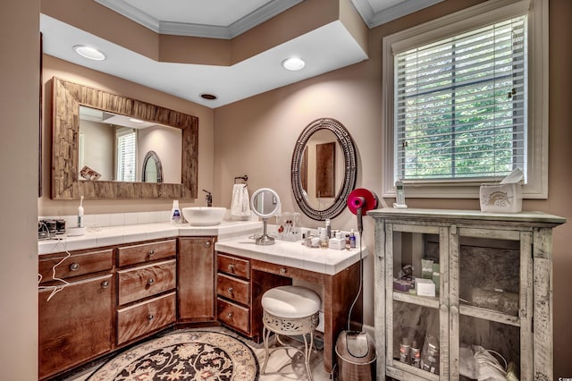 bathroom with recessed lighting, ornamental molding, and vanity