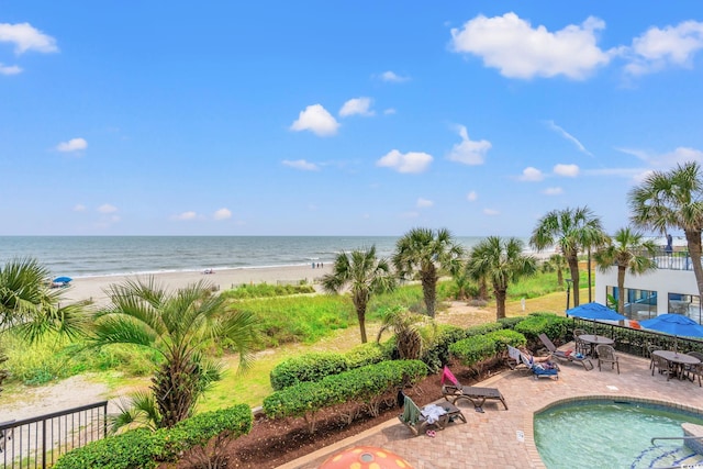 2401 S Ocean Blvd S Unit 267, Myrtle Beach, SC 29577 - community pool featuring a patio area, view of water and beach, outdoor dining area, and fence