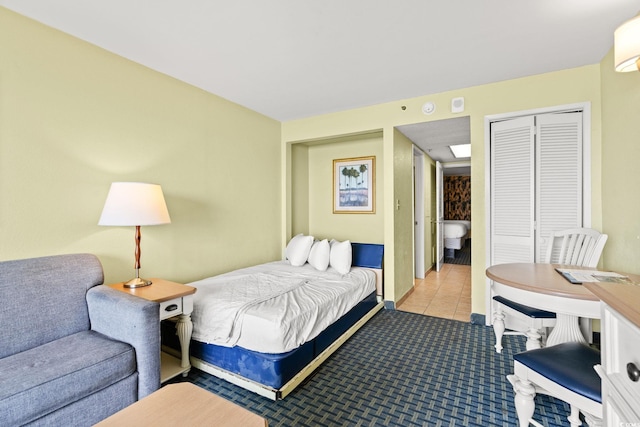 2401 S Ocean Blvd S Unit 267, Myrtle Beach, SC 29577 - tiled bedroom featuring a closet and carpet flooring