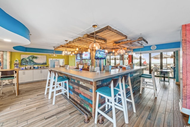 2401 S Ocean Blvd S Unit 267, Myrtle Beach, SC 29577 - community bar area featuring light wood-type flooring and pendant lighting