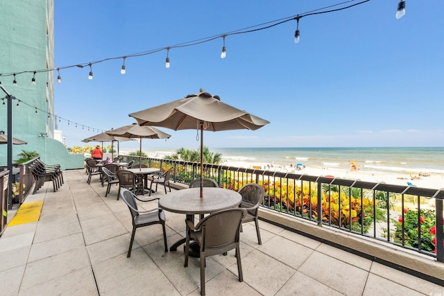 2401 S Ocean Blvd S Unit 267, Myrtle Beach, SC 29577 - view of patio with view of water and beach and outdoor dining area