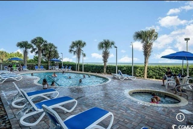 pool featuring a patio area