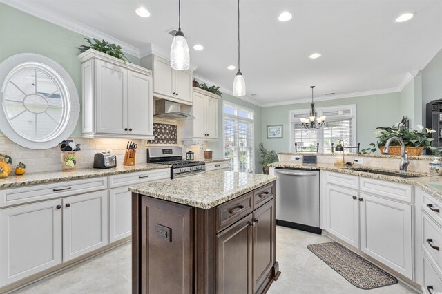 63 Grey Moss Rd, Murrells Inlet, SC 29576 - kitchen featuring appliances with stainless steel finishes, a sink, backsplash, a chandelier, and white cabinets