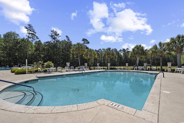 63 Grey Moss Rd, Murrells Inlet, SC 29576 - community pool with a patio area and view of scattered trees