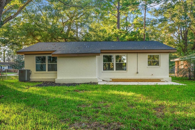 421 Villa Woods Dr, Myrtle Beach, SC 29579 - back of property with a lawn, a shingled roof, central AC, and fence