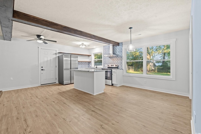 421 Villa Woods Dr, Myrtle Beach, SC 29579 - kitchen with a textured ceiling, appliances with stainless steel finishes, a center island, light wood finished floors, and wall chimney exhaust hood