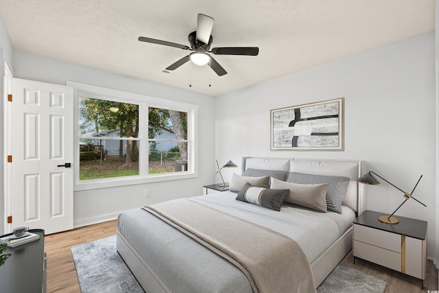 421 Villa Woods Dr, Myrtle Beach, SC 29579 - bedroom with baseboards, a ceiling fan, and wood finished floors