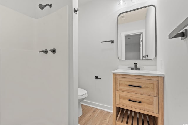421 Villa Woods Dr, Myrtle Beach, SC 29579 - bathroom featuring walk in shower, vanity, toilet, baseboards, and wood finished floors
