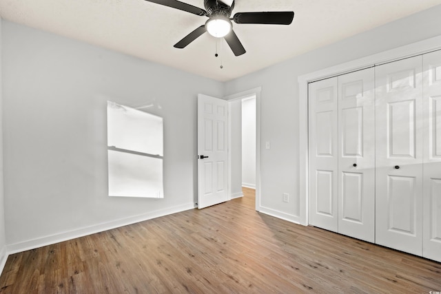 421 Villa Woods Dr, Myrtle Beach, SC 29579 - unfurnished bedroom with baseboards, a ceiling fan, a closet, and wood finished floors