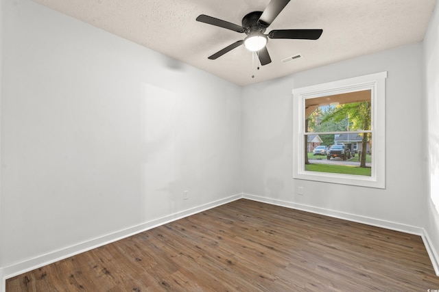 421 Villa Woods Dr, Myrtle Beach, SC 29579 - spare room featuring visible vents, wood finished floors, baseboards, ceiling fan, and a textured ceiling