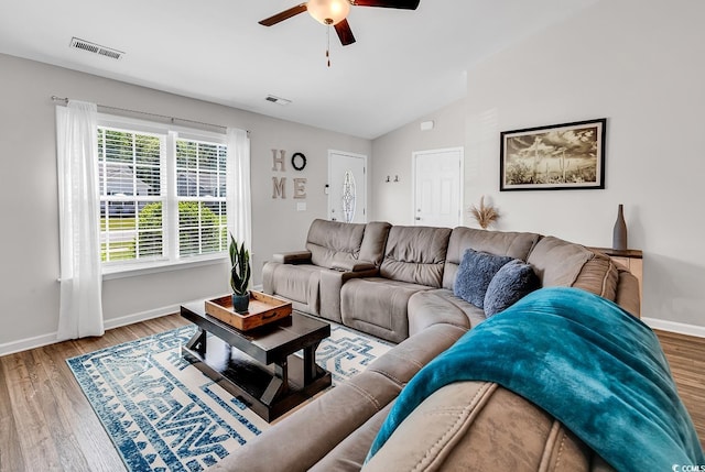 122 Desurrency Ct, Georgetown, SC 29440 - living room featuring a ceiling fan, baseboards, wood finished floors, vaulted ceiling, and visible vents