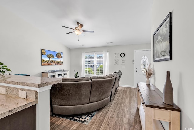 122 Desurrency Ct, Georgetown, SC 29440 - living area featuring visible vents, wood finished floors, lofted ceiling, baseboards, and ceiling fan
