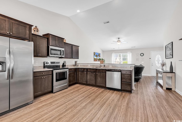 122 Desurrency Ct, Georgetown, SC 29440 - kitchen featuring a ceiling fan, appliances with stainless steel finishes, dark brown cabinets, a peninsula, and light wood-style flooring
