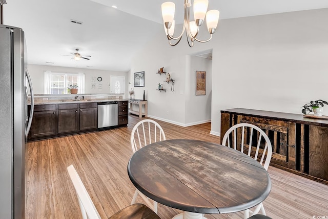 122 Desurrency Ct, Georgetown, SC 29440 - dining room featuring baseboards, ceiling fan with notable chandelier, and light wood-type flooring