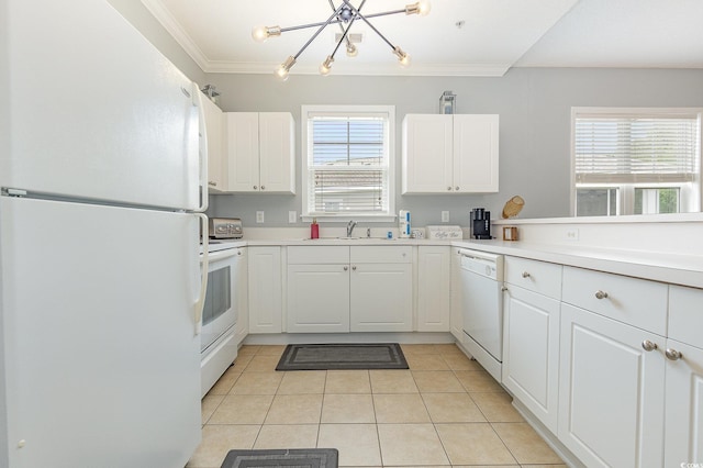 6253 Catalina Dr Unit 131, North Myrtle Beach, SC 29582 - kitchen featuring white appliances, a chandelier, light tile patterned floors, ornamental molding, and white cabinetry