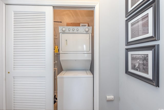 6253 Catalina Dr Unit 131, North Myrtle Beach, SC 29582 - clothes washing area featuring stacked washer / drying machine and laundry area