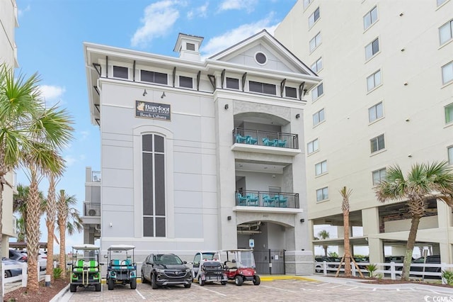 6253 Catalina Dr Unit 131, North Myrtle Beach, SC 29582 - view of property featuring uncovered parking