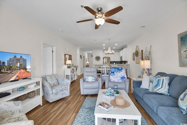 601 Hillside Dr N Unit 1405, North Myrtle Beach, SC 29582 - living area with crown molding, recessed lighting, ceiling fan with notable chandelier, and light wood-style floors