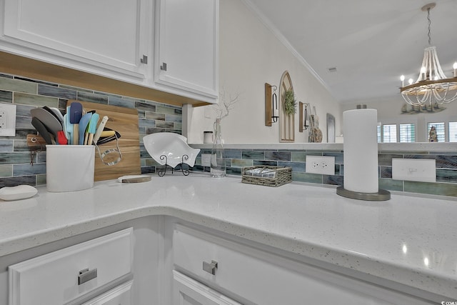 601 Hillside Dr N Unit 1405, North Myrtle Beach, SC 29582 - interior details with backsplash, white cabinets, a notable chandelier, and light stone counters