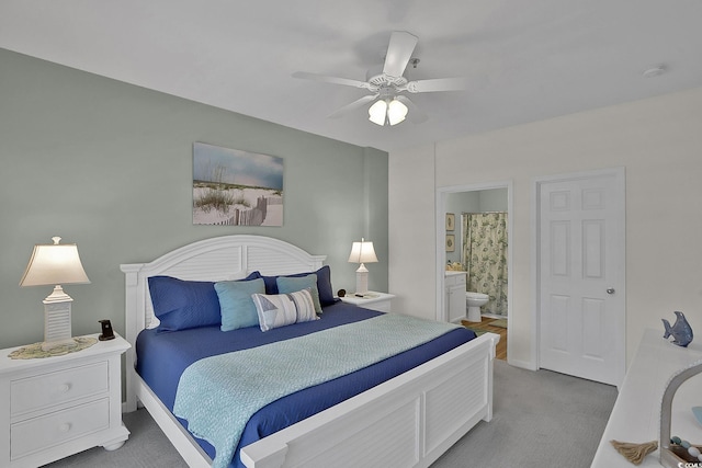 601 Hillside Dr N Unit 1405, North Myrtle Beach, SC 29582 - bedroom with baseboards, light carpet, a ceiling fan, and ensuite bath