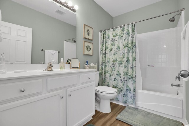 601 Hillside Dr N Unit 1405, North Myrtle Beach, SC 29582 - bathroom featuring vanity, visible vents, wood finished floors, shower / bath combination with curtain, and toilet
