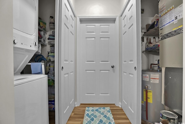 601 Hillside Dr N Unit 1405, North Myrtle Beach, SC 29582 - laundry room featuring water heater, laundry area, light wood-style flooring, and stacked washer / dryer