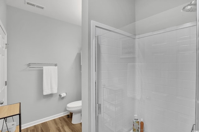 601 Hillside Dr N Unit 1405, North Myrtle Beach, SC 29582 - bathroom featuring toilet, baseboards, wood finished floors, visible vents, and a stall shower