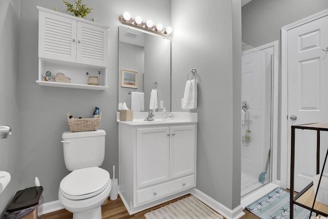 601 Hillside Dr N Unit 1405, North Myrtle Beach, SC 29582 - bathroom featuring vanity, toilet, baseboards, and a stall shower